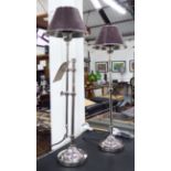 TABLE LAMPS, a pair, extending in chromed metal with leather shades, 74cm H.