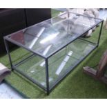 LOW TABLE, with glass top and shelf below, on a black metal frame, 110cm x 55cm x 42cm H.