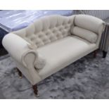 SOFA, two seater, in neutral fabric on turned castor supports, 138cm L.