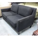 SOFA, two seater, in charcoal grey studded with square supports, 158cm L.