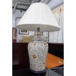 BALUSTER TABLE LAMP, in brown floral glaze on a cream ground, with pleated shade, 54cm H.