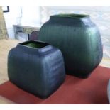NATUZZI VASES, a graduated pair in sea green, with a ribbed surround, largest 35cm H.