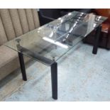 DINING TABLE, with a glass top on a black painted metal base, 180cm x 75cm x 74cm H.
