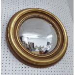 BUTLERS MIRRORS, a pair, circular in a gilded frame, 45cm dia.