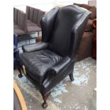 WINGBACK GEORGE SMITH ARMCHAIR, black leather, on claw supports, 90cm W.