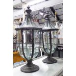 STORM LANTERNS, a pair, with five internal hanging night lights in a metal frame, 73cm H.