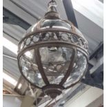 HANGING LAMP, in globe form, in a bronze effect frame, 66cm H, plus chain.