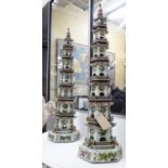 PAGODAS, a pair, Chinese style, in polychromed ceramic finish, 118cm H.