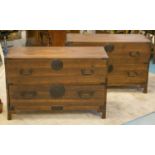 JAPANESE CHESTS, a pair, circa 1900 and later, each of two drawers with iron side handles,