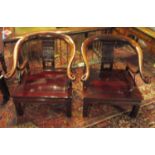 CHINESE OPEN ARMCHAIRS, a pair, rosewood with a horseshoe shaped back and a panelled seat,