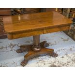 LIBRARY TABLE, William IV rosewood with two drawers on tapering pedestal and carved paw feet,