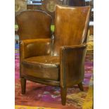 CLUB ARMCHAIRS, a pair, vintage tan brown leather each with raised back, cushion and stile supports,