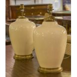 LAMPS, a pair, vase shaped ceramic cream crackelure and gilt metal rimmed,