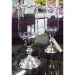 TABLE CANDLE LIGHTS, a pair, plated silvered bases glass tops with silver foliate decoration,