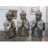 BUDDHA STATUES, a set of three, 17cm x 14cm x 40cm.