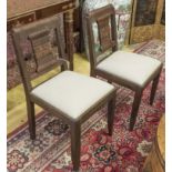 DINING CHAIRS, a set of six, Art Deco oak with leaf carved backs, each with drop in linen seat.
