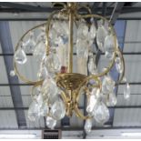 CHANDELIER, brass, with glass drops, 50cm H plus chain, together with a similar smaller chandelier,