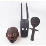 ASHANTI STYLE FERTILITY DOLL, carved wood, 38cm H; and two various tribal face masks.