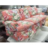 RALPH LAUREN SOFA, three seater, in a floral pattern on a red ground on square supports, 207cm L.