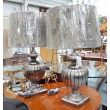 TABLE LAMPS, a pair, ribbed vase shaped on stand, in a silvered finish with shades, 86cm H.