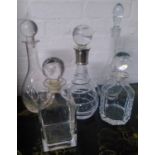 COLLECTION OF VARIOUS GLASS DECANTERS, one with silver collar, tallest 37cm H.