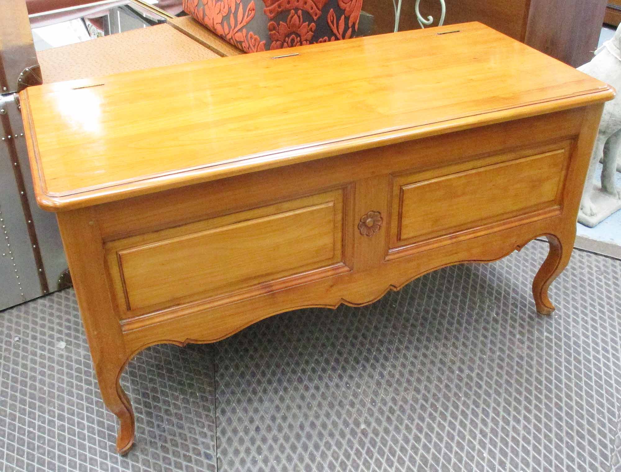 BLANKET BOX, in cherrywood, with a hinged lid on raised supports, 130cm x 53cm x 67cm H.