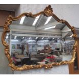 GILT FRAMED WALL MIRROR, with shell cresting, 91cm H x 122cm W max.