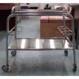 COCKTAIL TROLLEY, mid-century, polished tubular metal construction with mirrored tray,