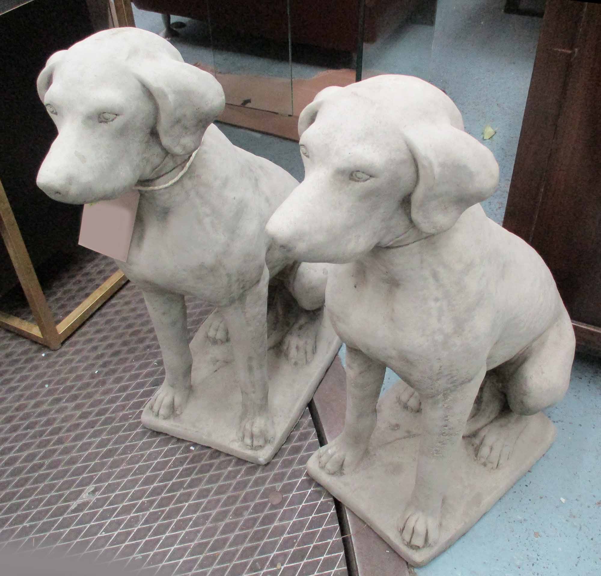 DOG STATUES, a pair, in reconstituted stone, 71cm H.