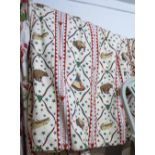 CURTAINS, a pair, with a native American theme lined and interlined, 110cm gathered by 206cm drops.