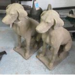 STONE DOG STATUES, a pair, 19th century Cotswold stone style with weathered finish, 75cm H x 60cm.
