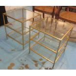 OCCASIONAL LOW TABLES, a pair, gilt metal framed, three tier, each with a square glass top,