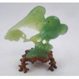 JADE BIRD CARVING, 20th century, on wooden stand, 17cm x 13.5cm H max.