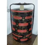 ORIENTAL BLACK LACQUER RICE CARRIER, in four sections with red and gilt detail, 44cm diamx 70cm H.