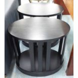 SIDE TABLES, a pair, oval in black, 60cm x 40cm x 54cm.