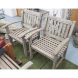 GARDEN ARMCHAIRS, a pair, weathered teak of slatted construction.