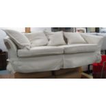 CONTEMPORARY SOFA, two seater, in ivory loose covers on turned supports, 220cm L.