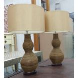 TABLE LAMPS, a pair, wicker with shades, 61cm H.