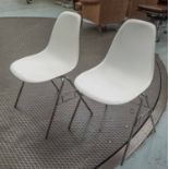 DSS STACKING CHAIRS, a set of six, Eames style, in white fibreglass on chromed tubular supports,