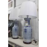 TABLE LAMPS, a pair, Chinese style blue and white converted vases on bases, with shades, 100cm H.