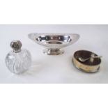 AN EDWARDIAN SILVER FRUIT DISH, of oval footed form, 13oz, a silver topped scent bottle,