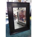 MIRROR, bevelled in a black frame, 131cm x 101cm.