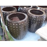 GARDEN POTS, a set of three, Dalek style in a treacle brown glaze, 41cm diam x 54cm H.