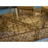 LOW TABLE, vintage rounded rectangular glazed and foliate gilt metal support, 128cm x 62cm x 45cm H.