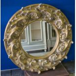 WALL MIRROR, circular foliate gilt and aged resin, 110cm diam.