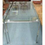 DINING TABLE, with glass top on chromed metal supports, 160cm x 80cm x 75cm.