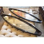 WALL MIRRORS, a pair, 1960's, ebonised, originally from a boat, 135cm H.