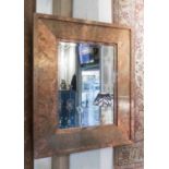 WALL MIRRORS, a pair, rectangular mottled copper, each with a central bevelled plate,