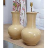 LAMPS, a pair, light tanned glazed, peach skin effect ceramic, 55cm H.