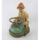 POTTERY BOY, contemplating a glass fish bowl, 35cm H max.